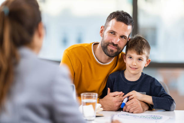 istock Loving single father and his son having a counseling session. 1352244661