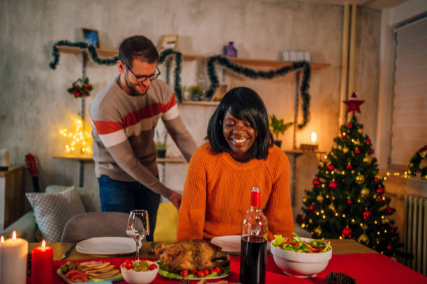 istock Caring boyfriend pulling chair out for his girlfriend 1352246025