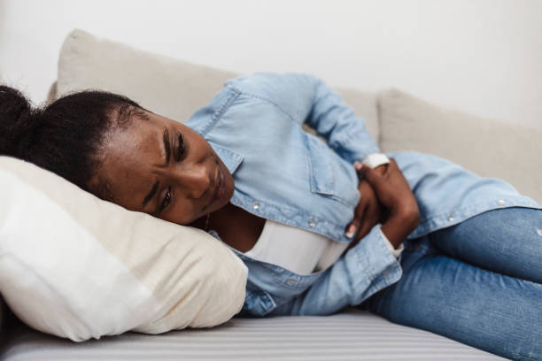 istock Woman experiencing stomach pain. 1352246262