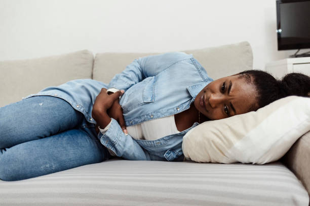 istock Woman experiencing stomach pain. 1352246392