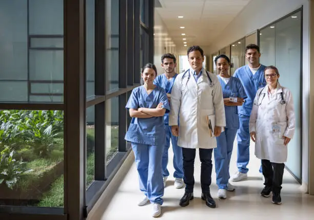 Photo of Team of doctors and nurses working at the hospital