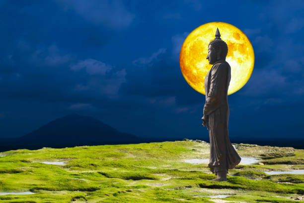 istock Full blood moon and Buddha looking seven day style on the night sky 1352253138
