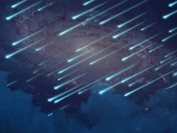 istock meteor rain on the night sky and blur galaxy on space 1352254314