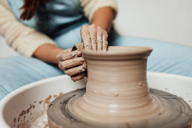 istock Female potter hands close up 1352255644