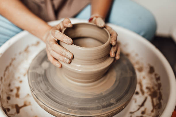 istock Female potter hands close up 1352255664