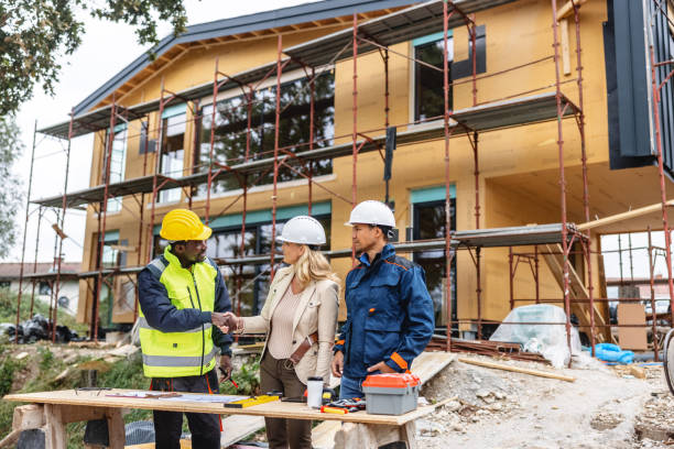 istock Female Architect And Construction Foreman Greeting One Another 1352256160
