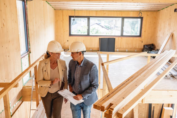istock Female Architect and Civil Engineer Reviewing Documents Together 1352256206