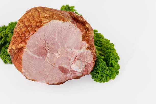 istock Pork ham sliced with herb on white background. 1352257468