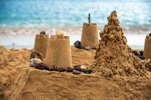 detail of a sandcastle by the sea
