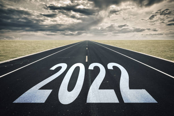 istock 2022 road perspective, dark clouds, crisis concept 1352257598