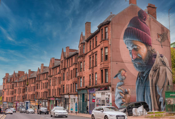 St Mungo Glasgow Mural, High Street The Smug mural depicts a modern- day St Mungo and references the story of The Bird That Never Flew. street art mural stock pictures, royalty-free photos & images