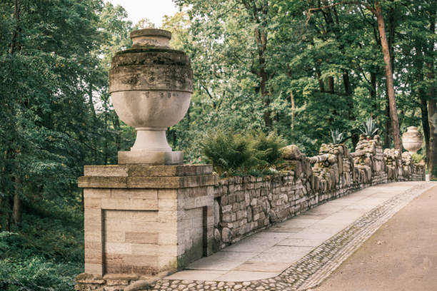 istock Old bridge with stone railings and flowerpots. 1352260768