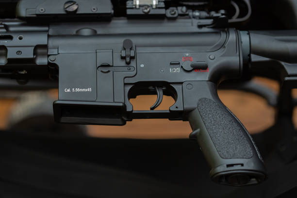 istock Close-up parts of automatic weapon with selective focus and blurred background 1352262688
