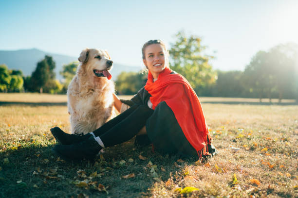 istock Girl with dog among nature 1352263010