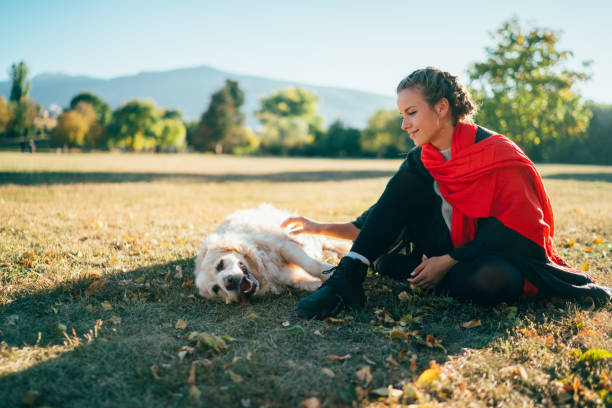 Girl with dog among nature