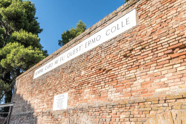 Recanati, Italy - August 13, 2021 - Famous wall of poet Giacomo Leopardi with text of his poem that means Always dear to me was this solitary hill Recanati, Italy - August 13, 2021 - Famous wall of poet Giacomo Leopardi with text of his poem that means Always dear to me was this solitary hill macerata italy stock pictures, royalty-free photos & images