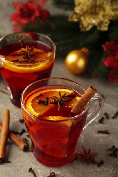 istock Mulled wine with cinnamon and anise stars on grey background. Thanksgiving Day 1352268085