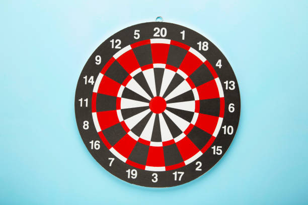 istock Dart board on the blue background with copy space. 1352268110