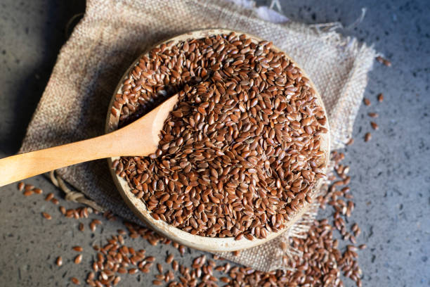 istock Flax seeds in a wooden bowl. 1352268271