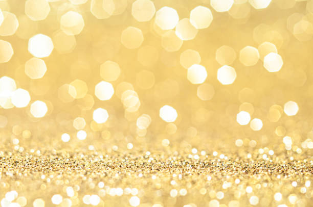 istock Gold,yellow abstract light background,Gold bokeh shining lights,sparkling glittering Christmas lights.Season greeting background.New year Luxury backdrop image.Blurred abstract holiday background. 1352270855