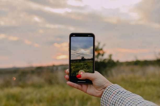 istock Woman holding phone 1352271235