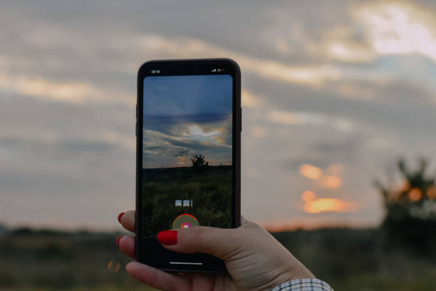 istock Woman holding phone 1352271257