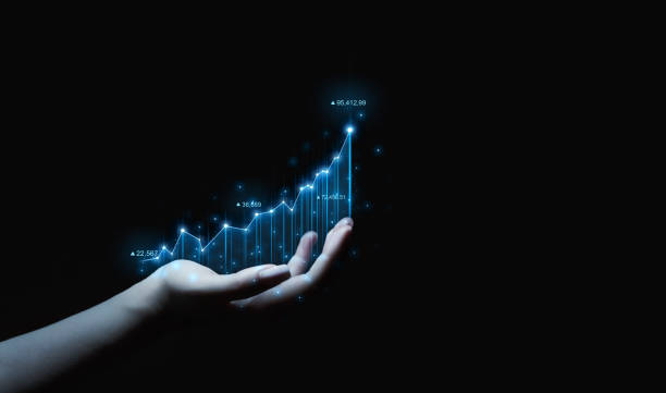 istock Hand holding analyzing graph financial data. Business finance technology and investment. Business strategy development and growing growth plan. 1352272305