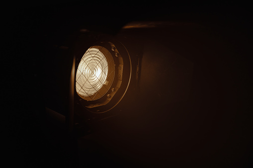 Photo of a professional cinema light with a fresnel lens. A powerful lighting device that is used for professional lighting of scenes in movies and theaters.
