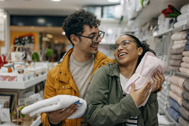 Young couple buying items for new apartment stock photo