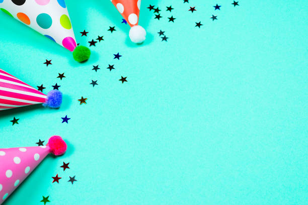 istock Colorful birthday caps on a blue background. Top view. 1352277231