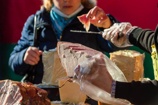 Petrozavodsk, Russia - 3 October 2021. Ham tasting at the street market. Selective focus