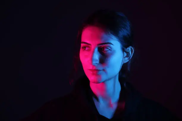 Photo of Young woman portrait with neon colors