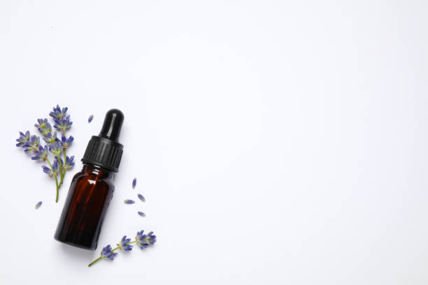 istock Composition with lavender flowers and natural essential oil on white background, top view 1352283388