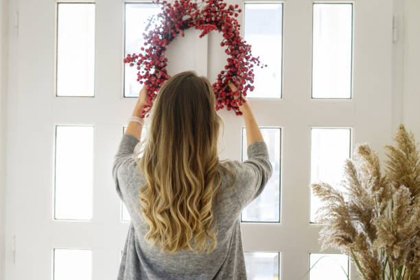 istock attractive middle aged woman  ( entrance hall, home decor) 1352283771