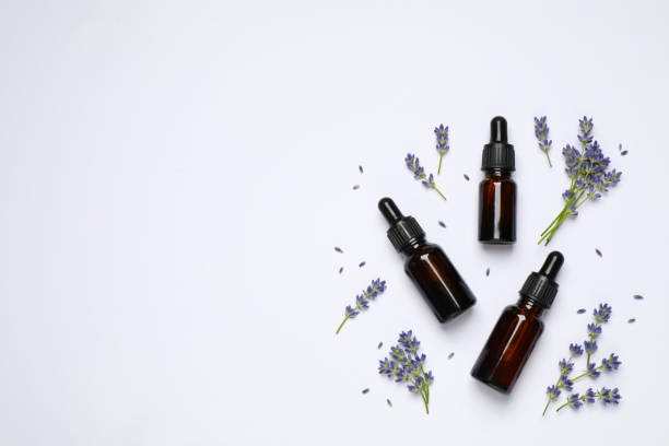 istock Composition with lavender flowers and natural essential oil on white background, top view 1352284521
