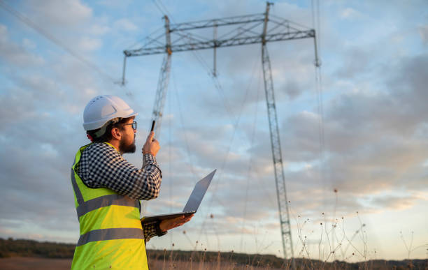 istock Engineer In Front Of Power Plant Using Laptop And Walkie Talkie 1352285885