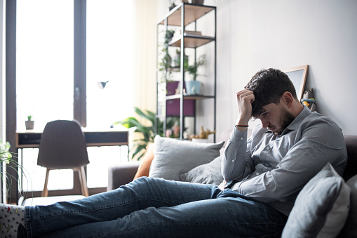 Overworked businessman at home