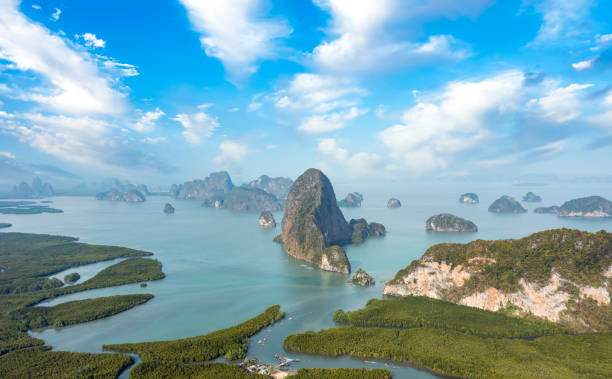 View from above, stunning aerial view of Phang Nga Bay (Ao Phang Nga National Park) with the sheer limestone karsts that jut vertically out of the emerald-green water, Thailand. stock photo