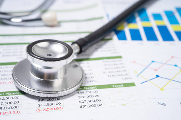 istock Stethoscope on charts and graphs paper, Finance, Account, Statistics, Investment, Analytic research data economy and Business company concept. 1352288153