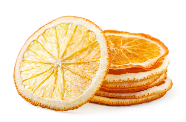 istock Dried orange slices heap on a white background. Isolated fruit chips 1352289413