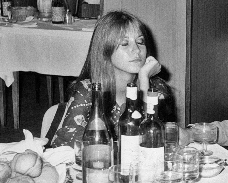 Young woman at table in a restaurant, 1968.