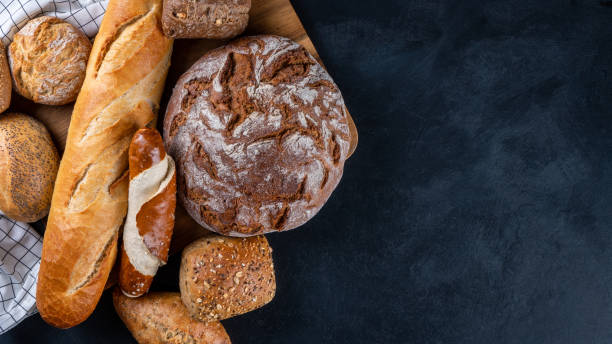istock Delicious freshly baked bread on a rustic background. Top view, copy space 1352291532