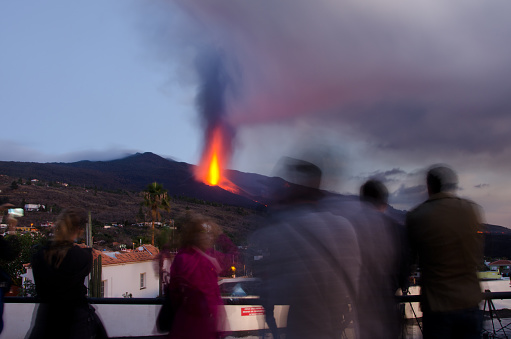 People watching the volcanic eruption of Cumbre Vieja at sunset. Tajuya. El Paso. La Palma. Canary Islands. Spain.