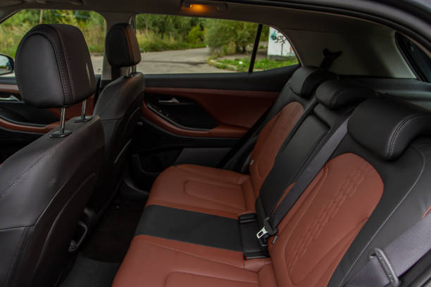 istock Modern SUV car inside. Leather black back passenger seats in modern luxury car. Comfortable leather seats. 1352296497