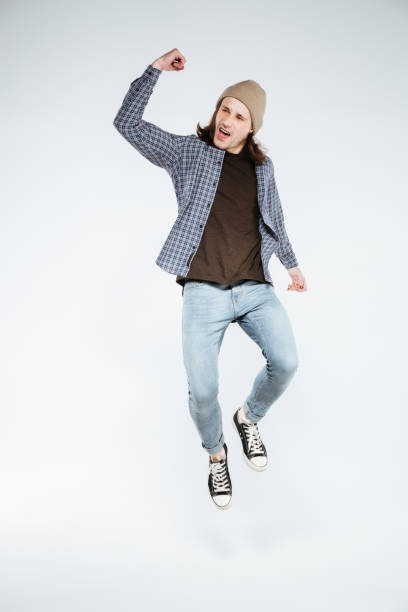 istock Vertical image of so happy hipster in studio 1352297344