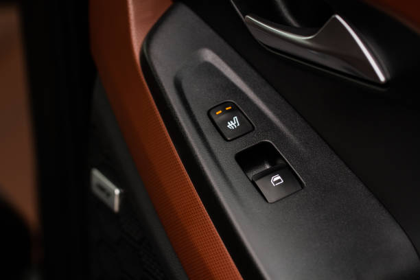 istock Seat heating controller buttons close up view. Car interior. Seat heater button, car interior. The heating mode is strong. 1352297375