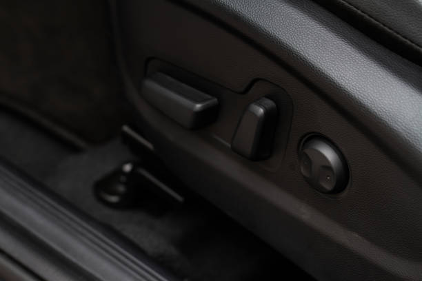 istock Electric car seat adjustment control panel close up view. Adjustable car seat position. Car interior. 1352297625