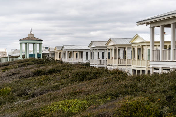 Cityscape coastline of town with gazebo pavilion in new urbanism architecture on beach ocean in Florida panhandle Seaside, USA - January 9, 2021: Cityscape coastline of town with gazebo pavilion in new urbanism architecture on beach ocean in Florida panhandle new urbanism stock pictures, royalty-free photos & images