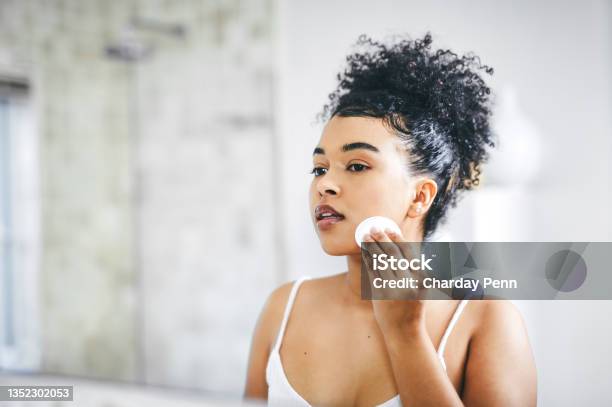 Shot Of A Beautiful Young Woman Going Through Her Morning Routine At Home Stock Photo - Download Image Now