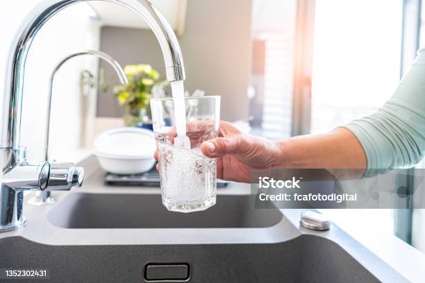 Filling Glass Of Water From The Tap Stock Photo - Download Image Now - Water, Drinking Water, Faucet